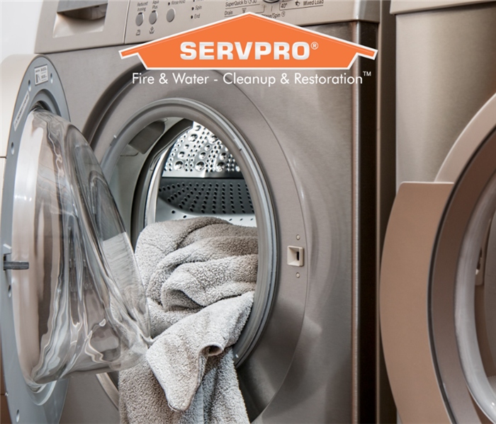 Clothes dryer with with SERVPRO logo.
