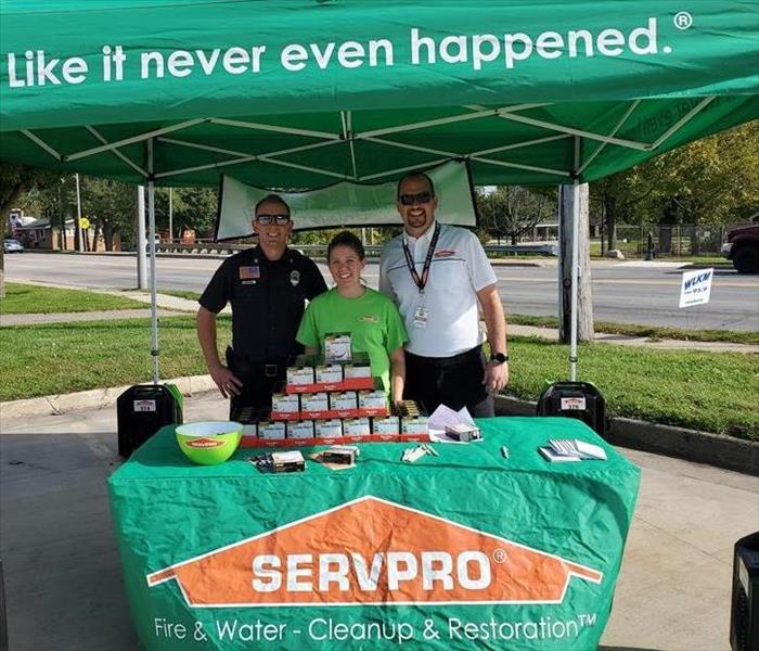 SERVPRO marketing manager, office manager, and local firefighter at smoke detector giveaway.