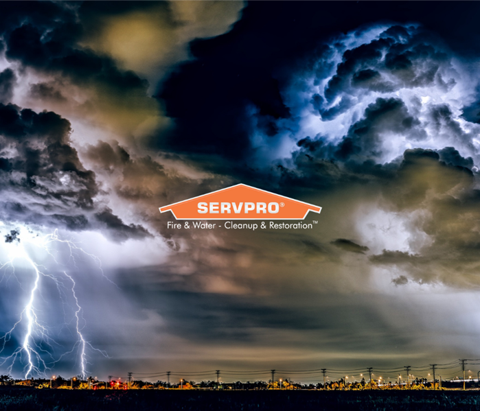 SERVPRO logo with lightning across city skyline