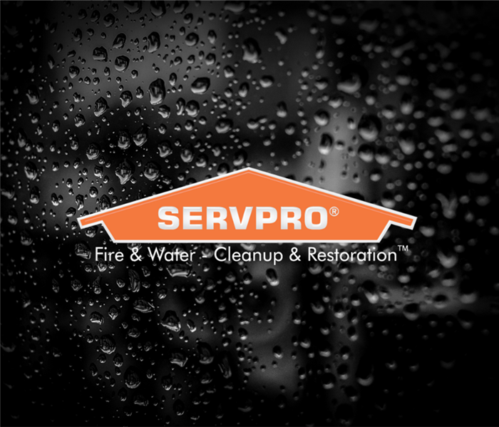 SERVPRO logo with rain in the background.