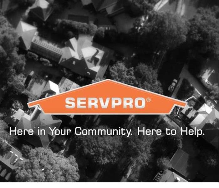 SERVPRO logo with houses in background with text underneath: Here in Your Community. Here to Help.