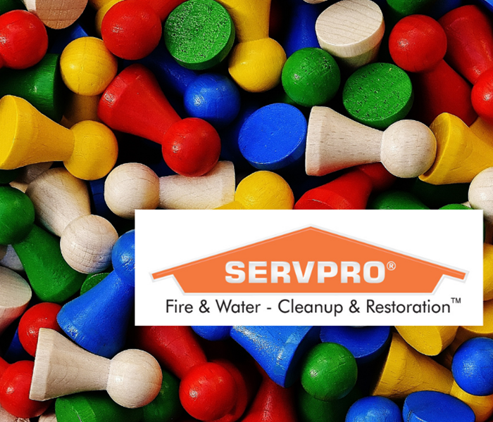 SERVPRO logo with small game pieces