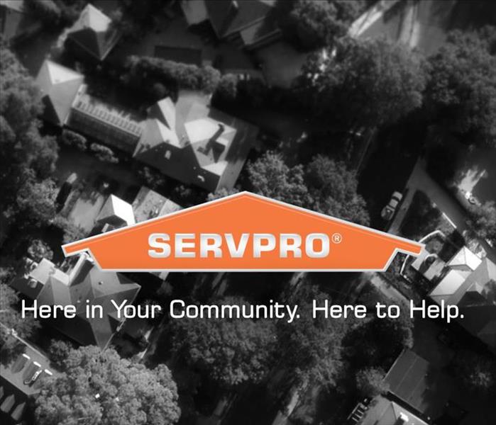 SERVPRO logo with community in background.