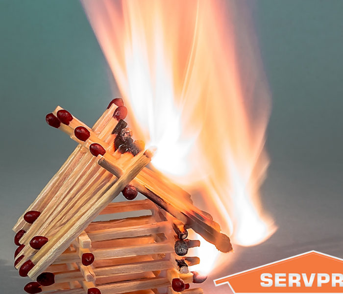 SERVPRO logo with matches in shape of a house on fire