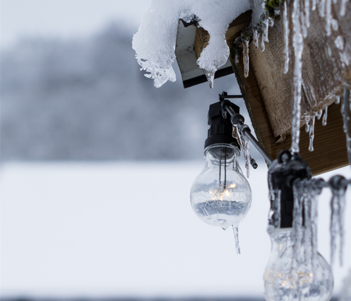 Icy gutters and hanging lightbulbs