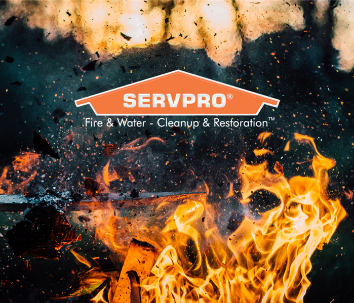 SERVPRO logo with fire underneath and water sprinkling on fire