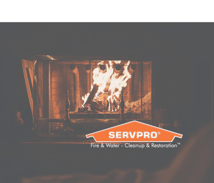 SERVPRO logo in front of fire in fireplace