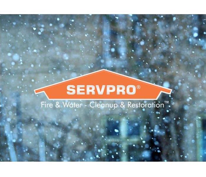 SERVPRO logo with snow in background.
